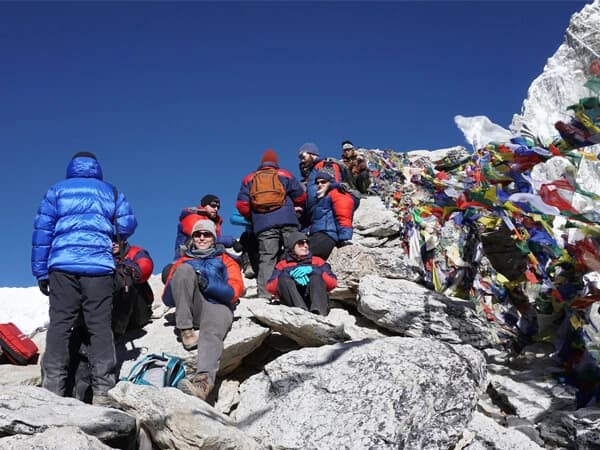 Trekkers with Mountain Monarch on one of the summits to see magnificent Mount Everest